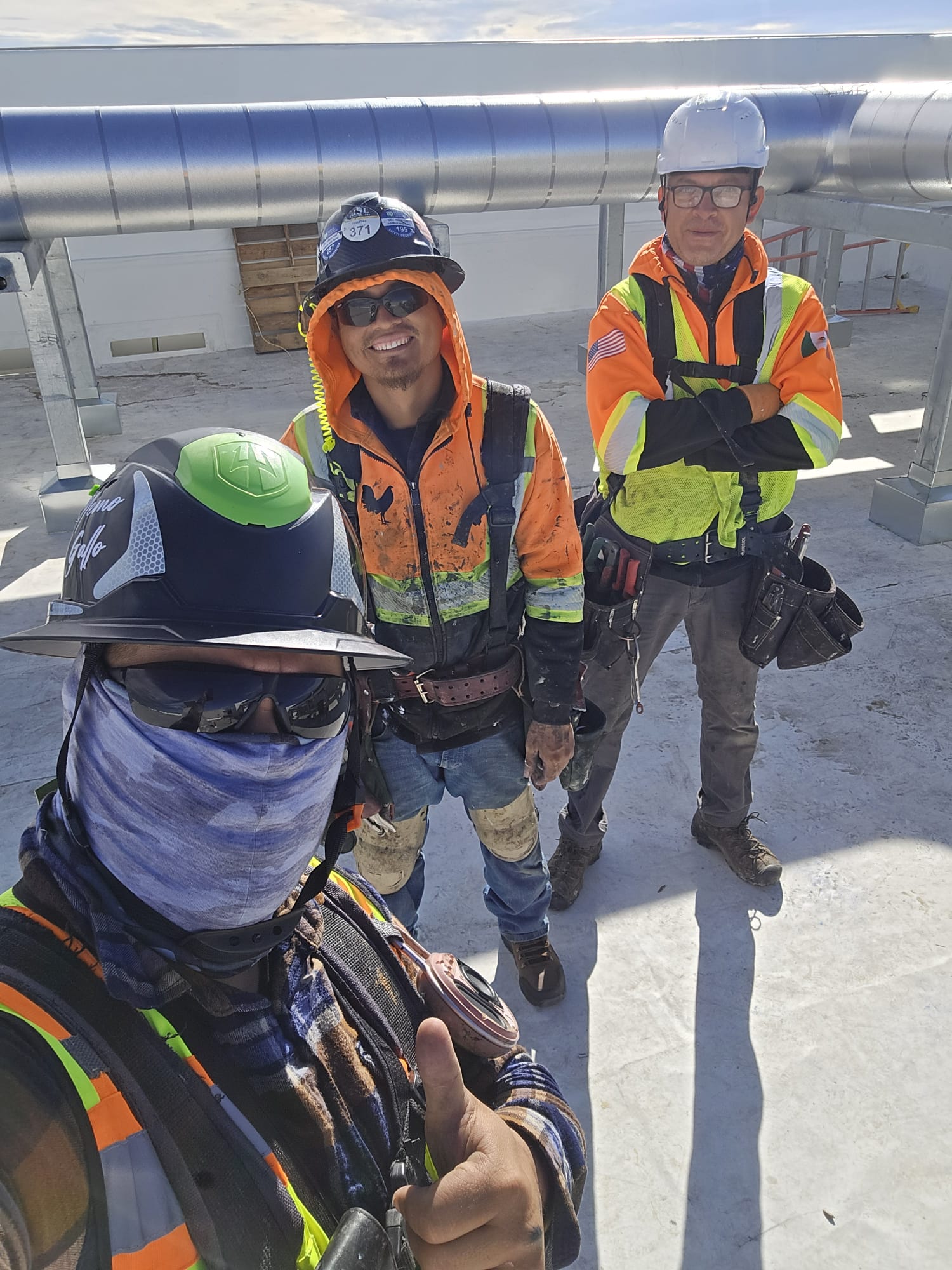 Golden Rooster crew working on a commercial rooftop project